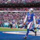 Tyrod Taylor of the Buffalo Bills celebrates after scoring a touchdown during the second quarter against the Miami Dolphins on December 17, 2017 at...