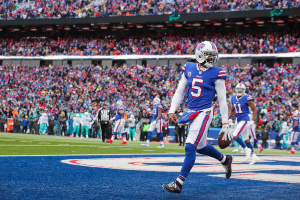 Tyrod Taylor of the Buffalo Bills celebrates after scoring a touchdown during the second quarter against the Miami Dolphins on December 17, 2017 at...